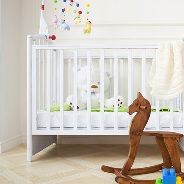 Children's cot and wooden rocking horse