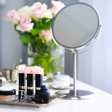 Mirror and makeup on dressing table