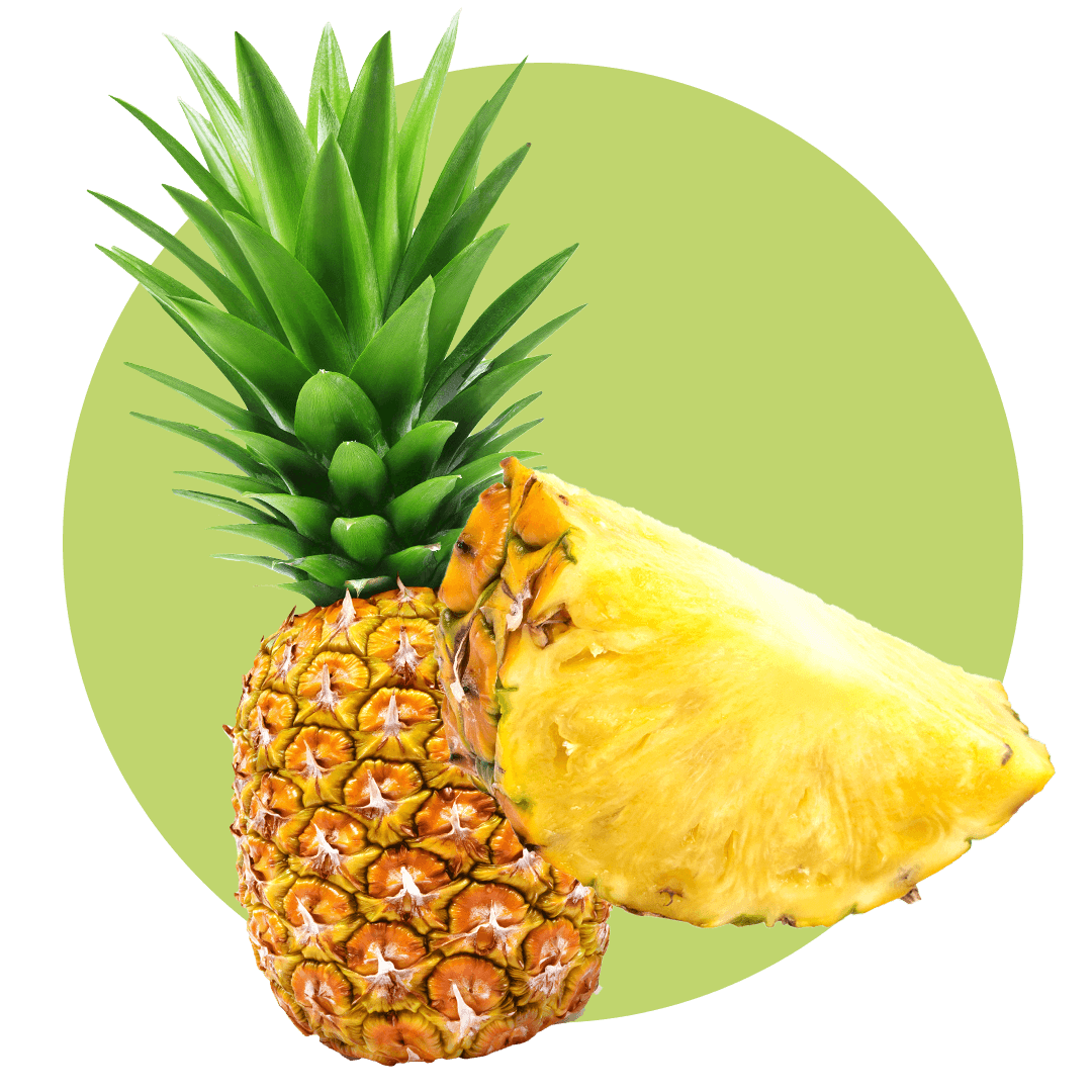Cut pineapple next to a whole pineapple