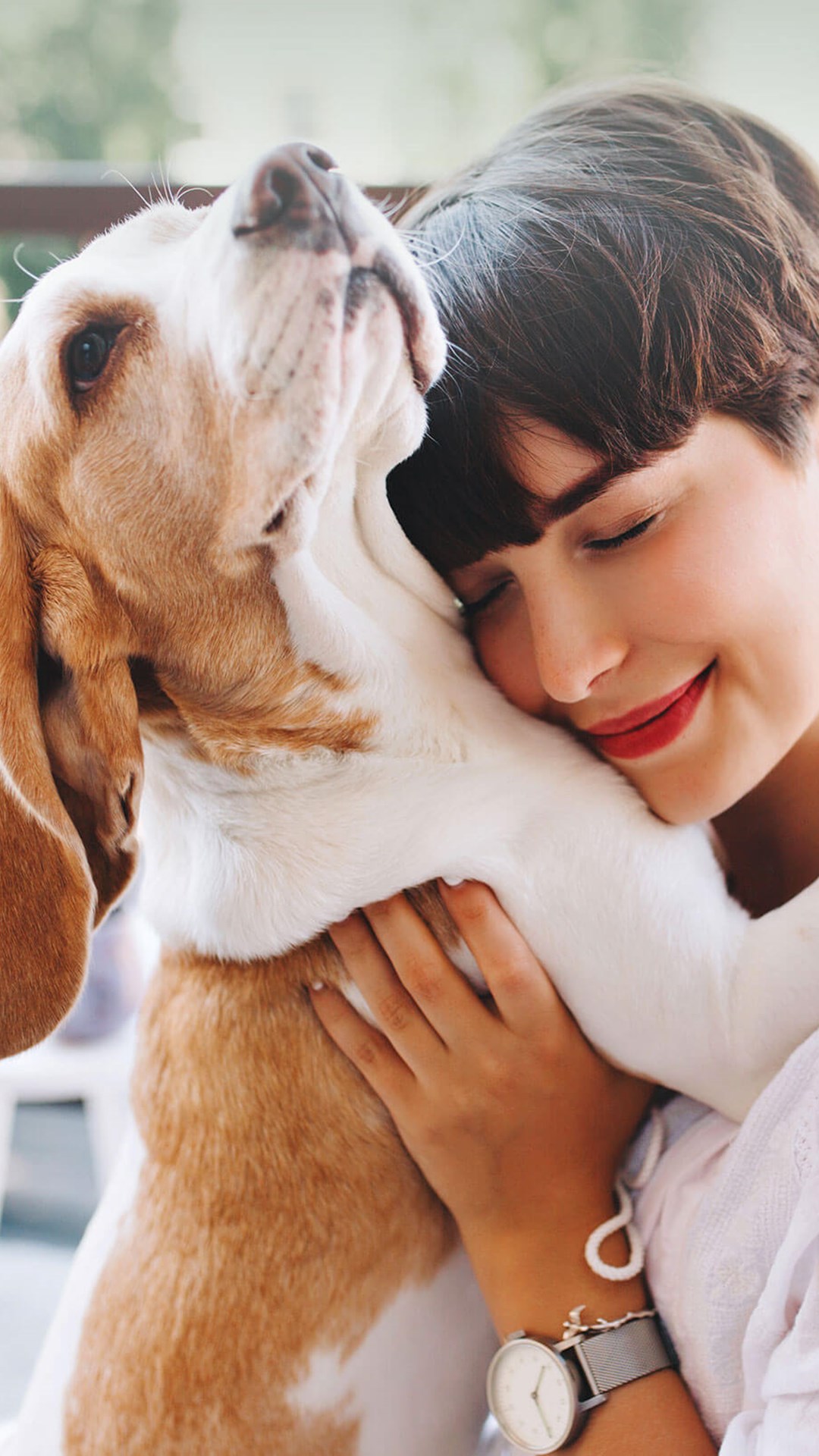 Woman hugging her dog