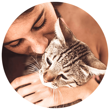 Woman kissing her cat