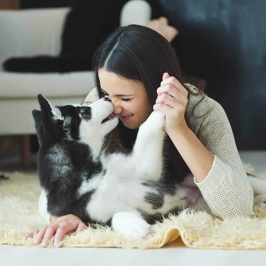 Woman playing with her dog